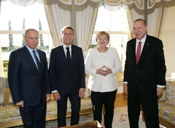 Russian President Vladimir Putin, France's Emmanuel Macron, German Chancellor Angela Merkel and Turkey's Recep Tayyip Erdogan meet in Istanbul for the Syrian summit