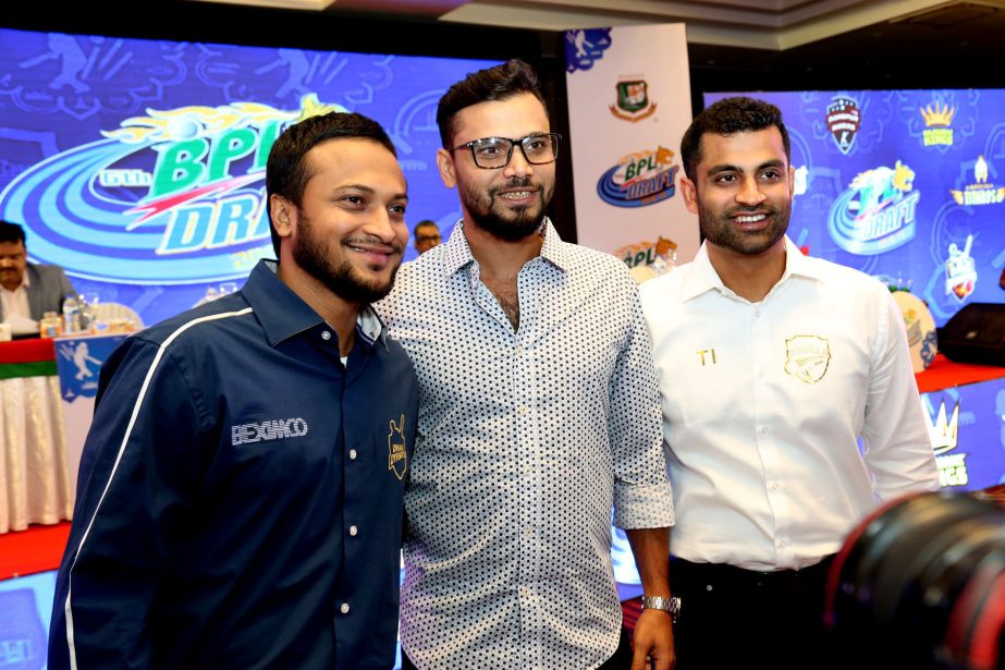 From left to right: Shakib Al Hasan, Mashrafe Bin Mortaza and Tamim Iqbal pose for a photo session after completing their players' draft of Bangladesh Premier League at the Hotel Radisson Blu in the city on Sunday.