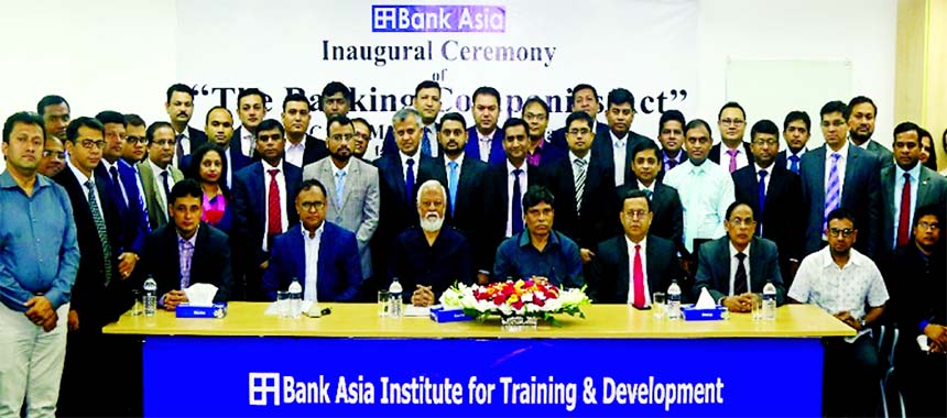 Md. Borhanuddin, Managing Director (Current Charge) of Bank Asia Ltd, poses for photo session with the participants of a workshop on "The Banking Company Act" at the Bank's Training Institute recently. Syed Anisul Huq, former Managing Director, discuss