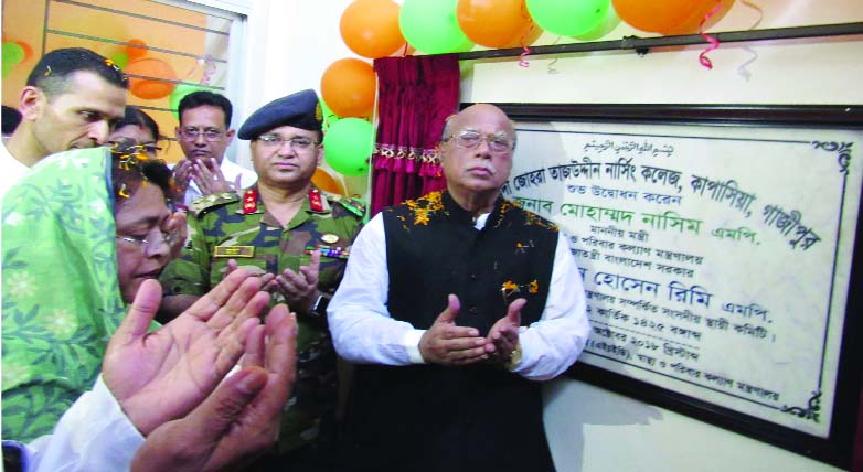 GAZIPUR: Health and Family Welfare Minister Md Nasim offering Munajat after inaugurating Syed Johara Tajuddin Nursing College at Kapasiya Upazila as Chief Guest on Saturday.