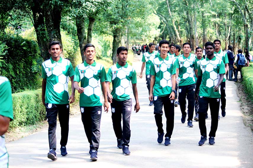 Players of Bangladesh Under-15 Football team walking at the street of Kathmandu as part of their practice on Tuesday.