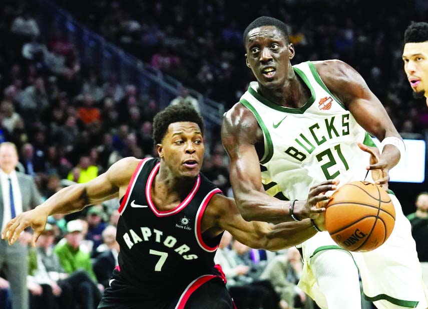 Milwaukee Bucks' Tony Snell tries to drive past Toronto Raptors' Kyle Lowry during the second half of an NBA basketball game in Milwaukee on Monday.