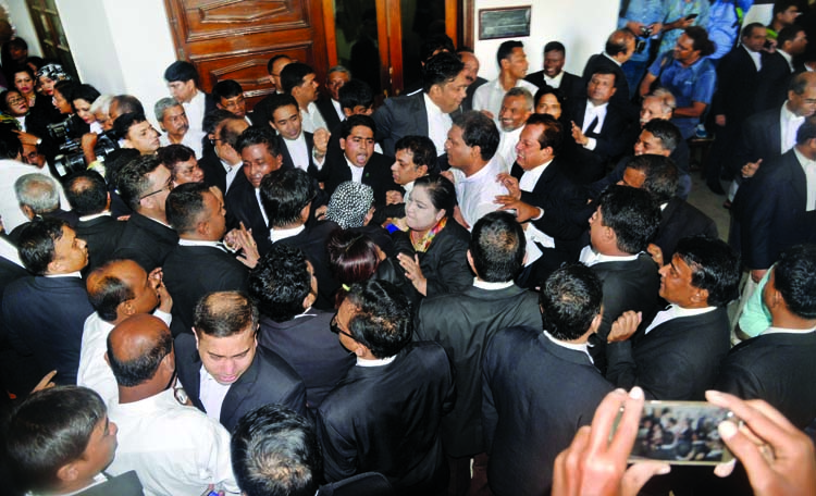 Pro-Awami league and BNP lawyers engaged in scuffle during court boycotting by pro-BNP lawyers centering increasing of jail term of BNP Chief Begum Khaleda Zia in Zia Orphanage Trust Case. The snap was taken from the High Court on Wednesday.