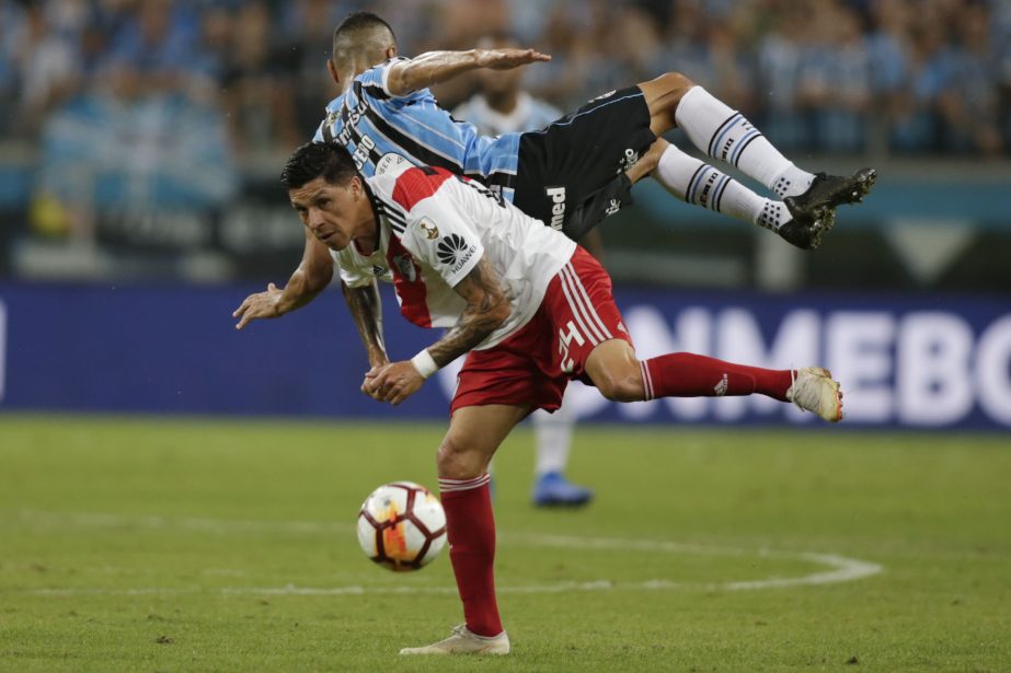 Enzo Perez of Argentina's River Plate (bottom) and Cicero of Brazil's Gremio battle for the ball during a Copa Libertadores second leg semifinal match in Porto Alegre, Brazil on Tuesday.