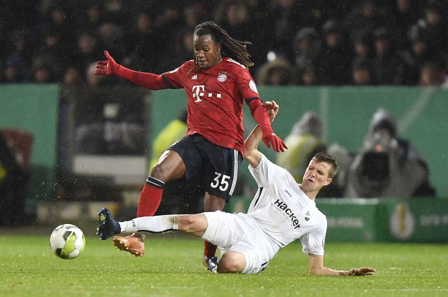 Roedinghausen's Fabian Kunze (right) and Bayern's Renato Sanches challenge for the ball during the German soccer cup, DFB Pokal, match between the 4th divisioner SV Roedinghausen and Bayern Munich in Osnabrueck, Germany on Tuesday. Roedinghausen was def