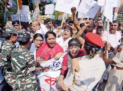 Activists of Assam Pradesh Congress Committee (APCC) shout slogans during a protest against the killings of five Bengali-speaking Hindu men by suspected Indian militants in Assam's Tinsukia district, in Guwahati on Friday.