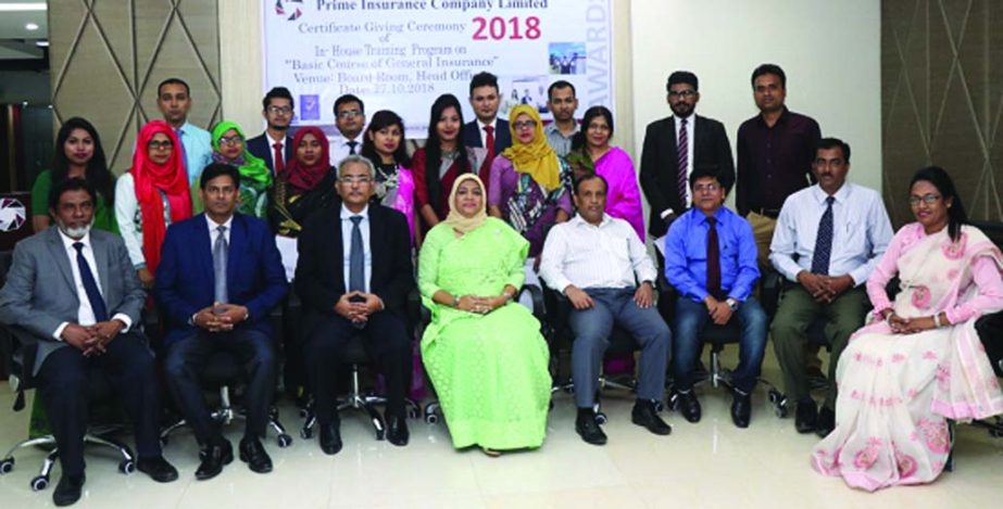 Mohammodi Khanam, Managing Director of Prime Insurance Company Limited, poses for a photograph with the winners of an in house training programme at its head office in the city recently. Bibekananda Saha, General Manager of Sadharan Bima Corporation and o