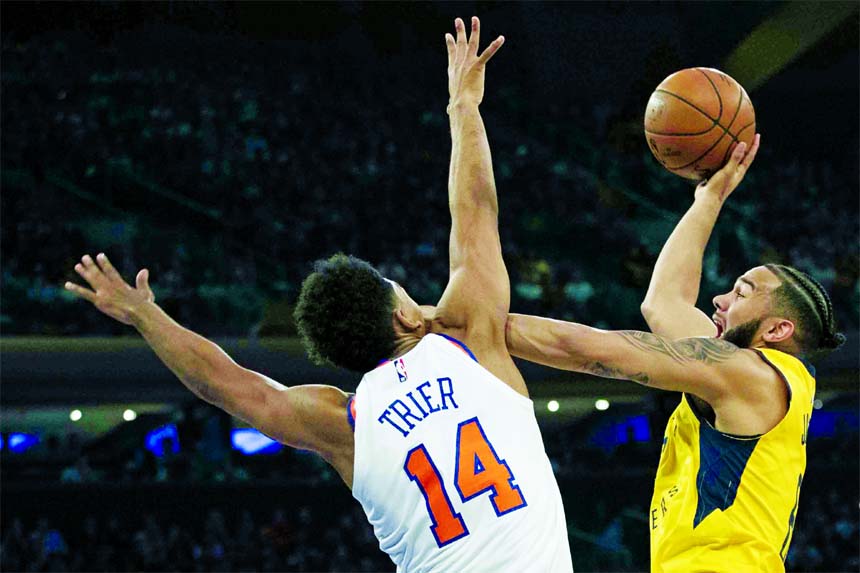 Indiana Pacers guard Cory Joseph (right) shoots as New York Knicks guard Allonzo Trier defends during the first half of an NBA basketball game at Madison Square Garden in New York on Wednesday.