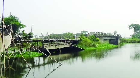 SHARIATPUR: The broken bridge at Borokandi Union in Jajira Upazila needs immediate repair . This snap was taken on Friday.