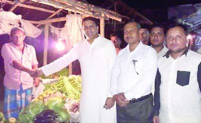 SYLHET: Adv Abdur Rakib Montu, Assistant Attorney General, Bangladesh Supreme Court and aspirant candidate of Awami League from Sylhet-3 Constituency shaking hands with people at Mongla Bazar during election campaign on Friday.