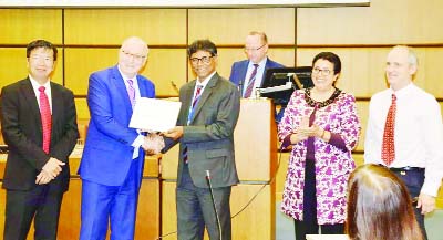 MYMENSINGH: Dr. Mohammad Shamsuddin, Professor of Surgery and Obstetrics of Bangladesh Agricultural University (BAU) receiving recognition of IAEA Merit Award 2018 for his excellent work at a function.