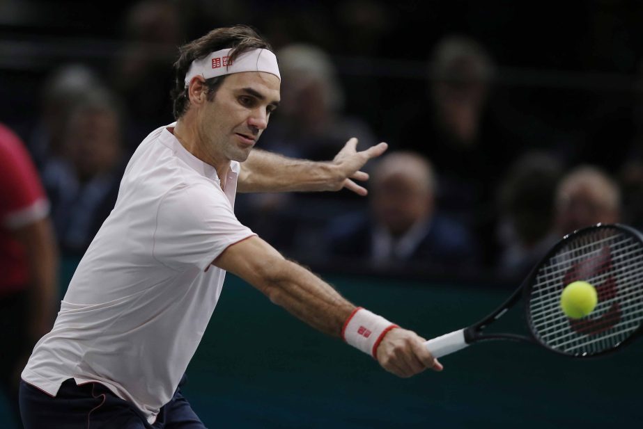 Roger Federer of Switzerland, returns the ball to Kei Nishikori of Japan, during their quarterfinal match of the Paris Masters tennis tournament at the Bercy Arena in Paris, France on Friday. Roger Federer won 6-4, 6-4.
