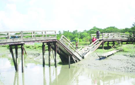 BAGERHAT: A view of the broken Laksmikhali Bridge at Purbo Sayera Village which needs immediate repair . This snap was taken yesterday.