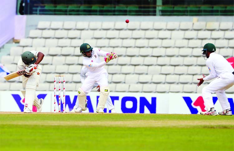 Wicketkeeper Mushfiqur Rahim (2nd from left) tries to hold a catch of Wellington Masakadza on the second day of the first Test between Bangladesh and Zimbabwe at Sylhet International Cricket Stadium in Sylhet on Sunday.