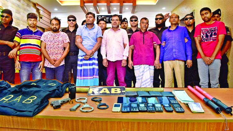 RAB arrested seven members of a criminal gang from city's Kawla area on Sunday night with a foreign pistol and other materials from their possessions.