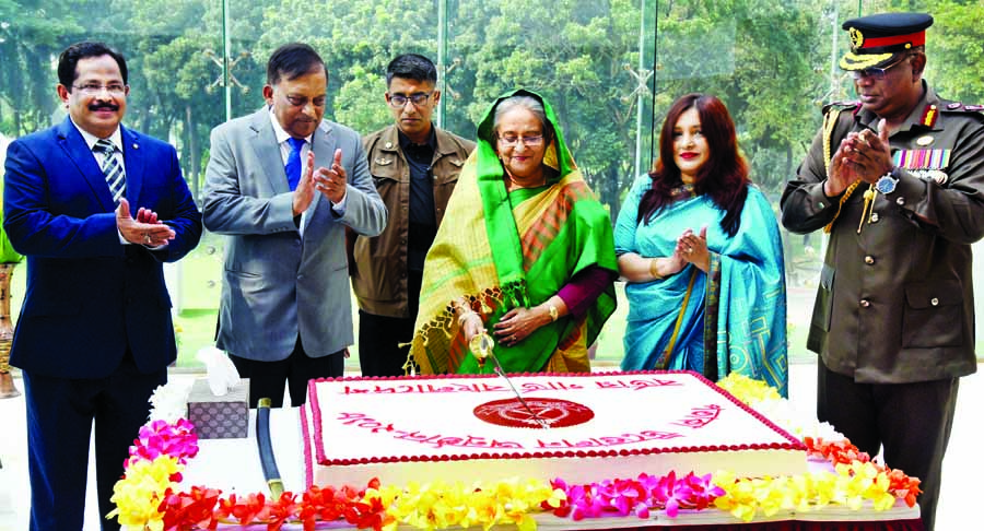 Prime Minister Sheikh Hasina cutting cake at the flag hoisting ceremony of Ramu region, Narayanganj and Gazipur battalion at Pilkhana Border Guard Bangladesh (BGB) Headquarters in the city on Thursday. BSS photo