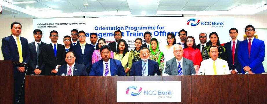 Md. Nurun Newaz Salim, Chairman of NCC Bank Limited, poses for a photo session with the participants of a 3 days-long "Orientation Programme" for its 41 newly recruited Management Trainee Officers at its Training Institute in the city on Tuesday. Mosleh