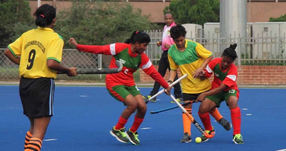 A scene from the women's hockey match of the Invitational Hockey Tournament between Dhaka XI and Kolkata Warriors at the Maulana Bhashani National Hockey Stadium on Thursday. Dhaka XI won the match 3-0.