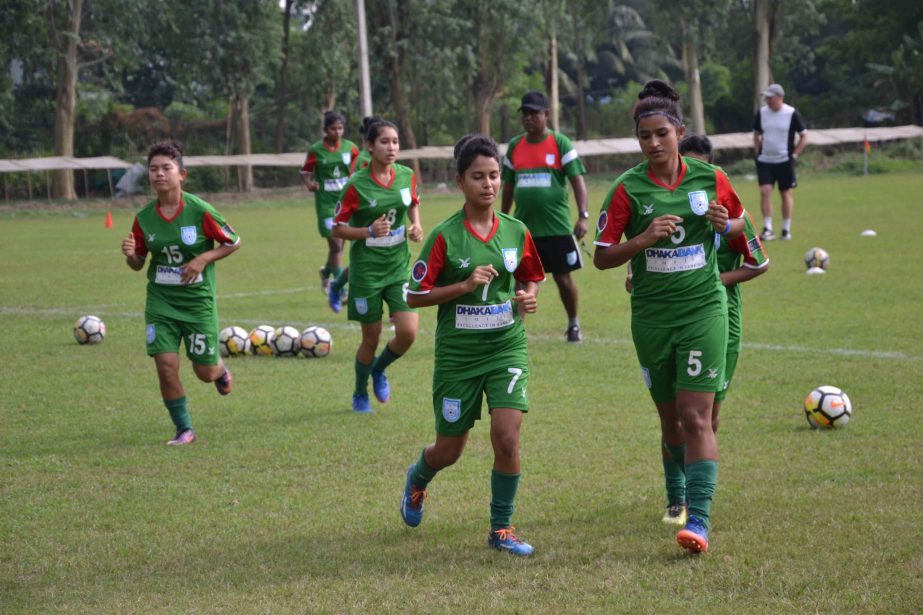 Members of Bangladesh Olympic Women's Football team during their practice session at Yangon in Myanmar on Saturday. Bangladesh will face their counterpart India today in their Asian Qualifiers of the Women's Olympic Football Tournament.