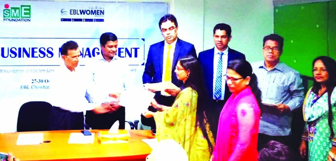 Jiban Krishno Roy, General Manager, Sylhet Office of Bangladesh Bank, handing over the certificates to the participants of the "SME Business Management Training for Women Entrepreneurs" jointly organized by Eastern Bank Limited with SME Foundation at a