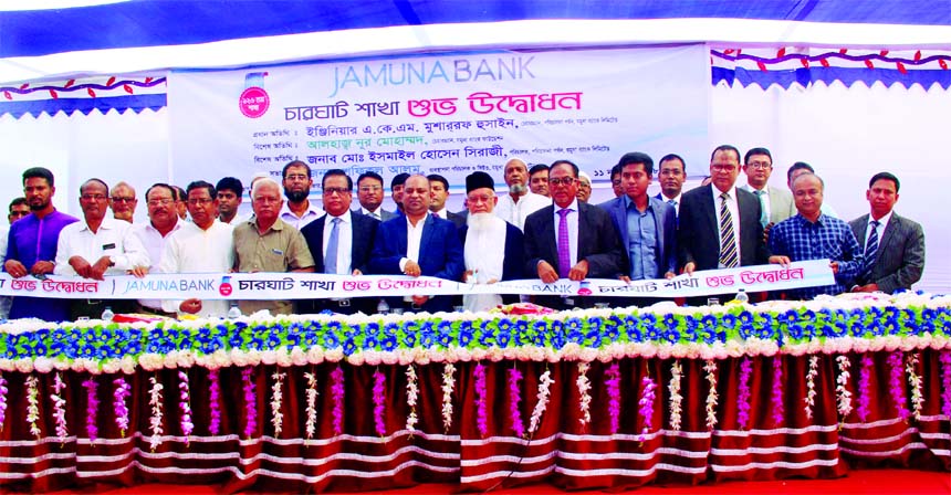Eng. AKM Mosharraf Hussain, Chairman of Jamuna Bank Limited, inaugurating its 126th Branch at Charghat in Bagha in Rajshahi recently. Shafiqul Alam, Managing Director, Nur Mohammed, Chairman of Jamuna Bank Foundation, Md. Ismail Hossain Siraji, Director,