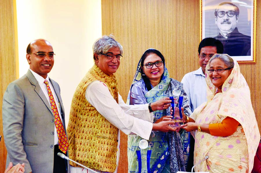 Prime Minister Sheikh Hasina receiving ASOCIO 2018 Digital Government Award from Post, Telecommunication and Information Technology Minister Mostofa Zabbar at the cabinet meeting on Monday. PID photo