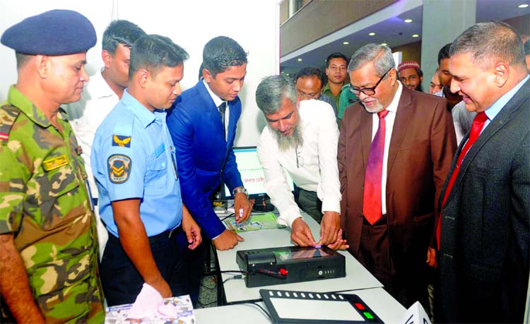 Chief Election Commissioner KM Nurul Huda visiting a stall of Electronic Voting Machines (EVMs) at the Bangabandhu International Conference Centre in city's Sher-e-Bangla Nagar on Monday.