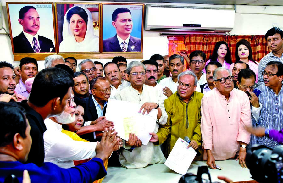 BNP Secretary General Mirza Fakhrul Islam Alamgir, Standing Committee Members Mirza Abbas and Nazrul Islam Khan purchase 3 nomination forms on behalf of party Chairperson Khaleda Zia from Naya Paltan office on Monday.