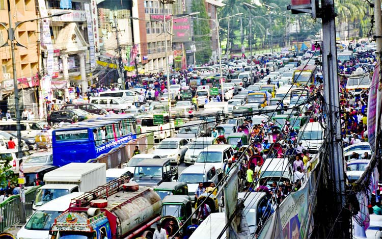 City people experienced huge traffic gridlock due to selling of nomination forms by various political parties for participating in next National Election. This picture was taken from Naya Paltan area on Monday.
