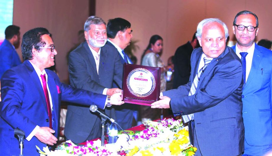 Professor Md. Nazmul Hassan, Chairman of Islami Bank Bangladesh Limited, receiving the Highest Taxpayer Award in the banking sector in 2017-2018 tax year from State Minister for Finance and Planning Ministry MA Mannan MP, at Pan Pacific Sonargaon Hotel on