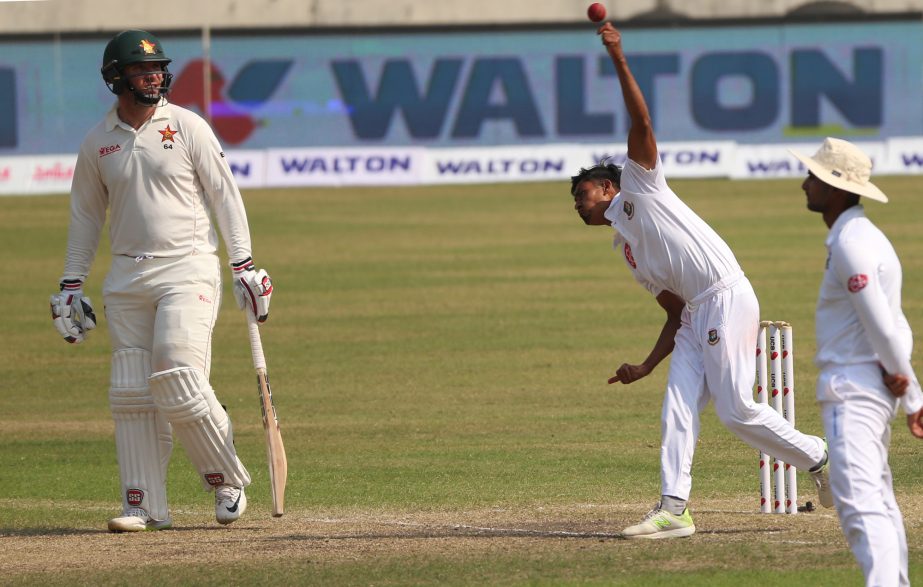 Taijul Islam (center) of Bangladesh in action during the third day play of the second Test between Bangladesh and Zimbabwe at the Sher-e-Bangla National Cricket Stadium in the city's Mirpur on Tuesday. Taijul bagged five wickets at the cos