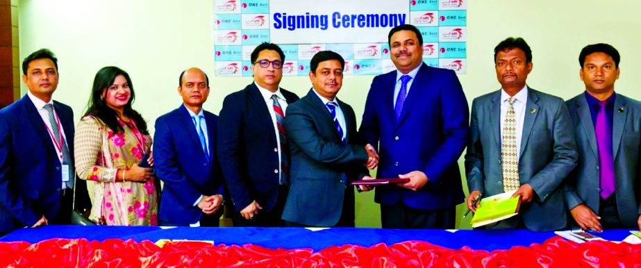 Md. Kamruzzaman, Head of Retail Banking of ONE Bank Limited (OBL) and Richard Pereira, General Manager of FARS Hotel & Resorts, exchanging a MoU signing document at the Bank head office in the city recently. Under the deal, Credit, Debit and Prepaid cardh