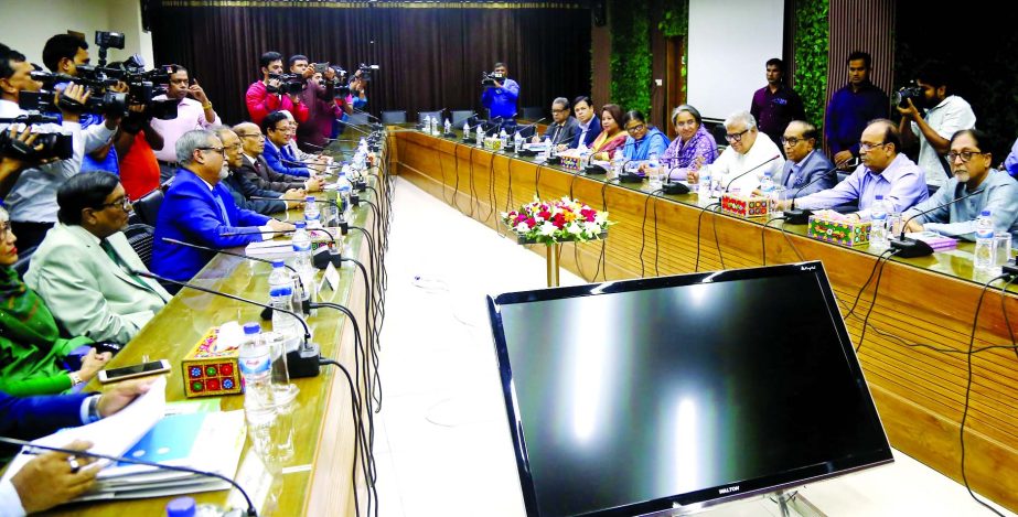 Awami League delegation headed by Prime Minister's Political Adviser HT Imam holding talks with CEC KM Nurul Huda on various election-related issues at Nirbachon Bhaban on Wednesday.