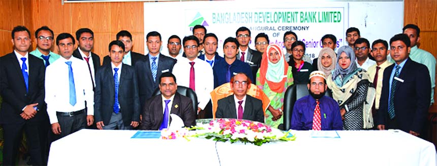 Manjur Ahmed, Managing Director of Bangladesh Development Bank Limited, poses for a photo session with the participants of a 5 days orientation programme for 65 newly appointed officers at its Training Institute in the city recently. Concerned officials o