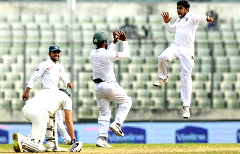 Mehidy Hasan Miraz (right) of Bangladesh celebrating with his teammates after dismissal of a Zimbabwe wicket during the fifth day play of the second Test at the Sher-e-Bangla National Cricket Stadium in the city's Mirpur on Thursday. Miraz bagged five wi