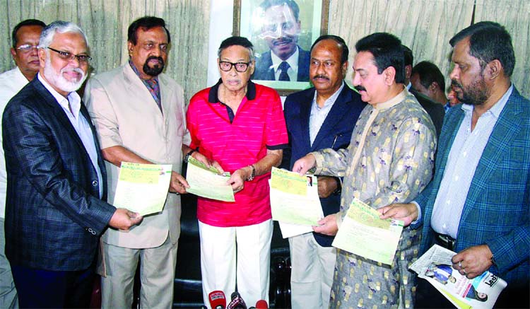 Secretary General of Jatiya Party ABM Ruhul Amin Hawlader along with other presidium members of the party submitting nomination forms for the eleventh parliamentary elections to the party Chairman Hussain Muhammad Ershad at its Banani office in the city o