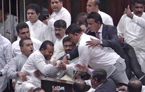 Rival lawmakers have exchanged blows in Sri Lanka's Parliament as the disputed Prime Minister Mahinda Rajapaksa claimed the Speaker had no authority to remove him from office by voice vote.