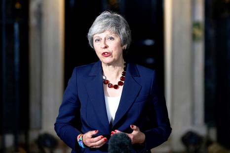 Britain's Prime Minister Theresa May gives a statement outside 10 Downing Street in London after holding a Cabinet meeting.