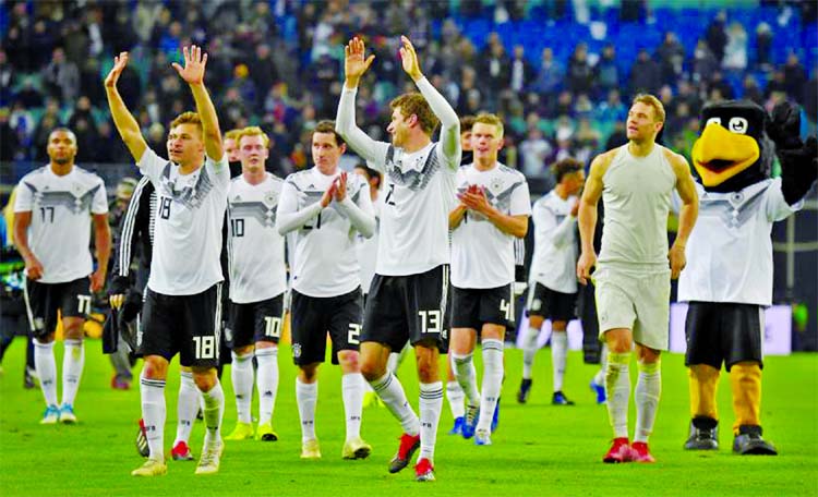 Germany players applaud the fans after the match against Russia at Red Bull Arena, Leipzig,Germany on Thursday.