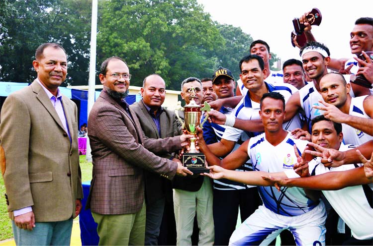 Assistant Chief of Naval Staff (Material) Rear Admiral M Shafiul Azam giving away trophy to Bangladesh Navy team, who clinched Inter-Service Basketball title at BAF Base Bangabandhu in the city's Kurmitola on Thursday.