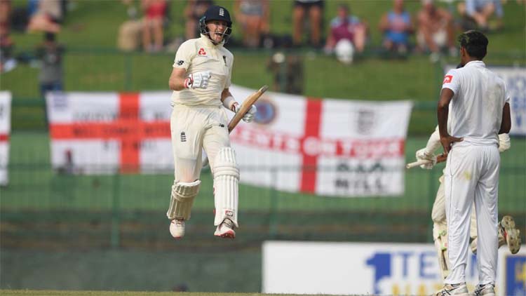 Joe Root of England celebrating after scoring his second Test century on the Asian sub-continent against Sri Lanka at Kandy on Friday.