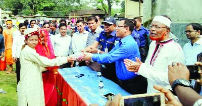 GAIBANDHA: Sebasting Rema, DC, Gaibandha distributing prizes among the winners of a cultural competition at Shadhinata premises on the occasion of the Nabanna Utsab recently.