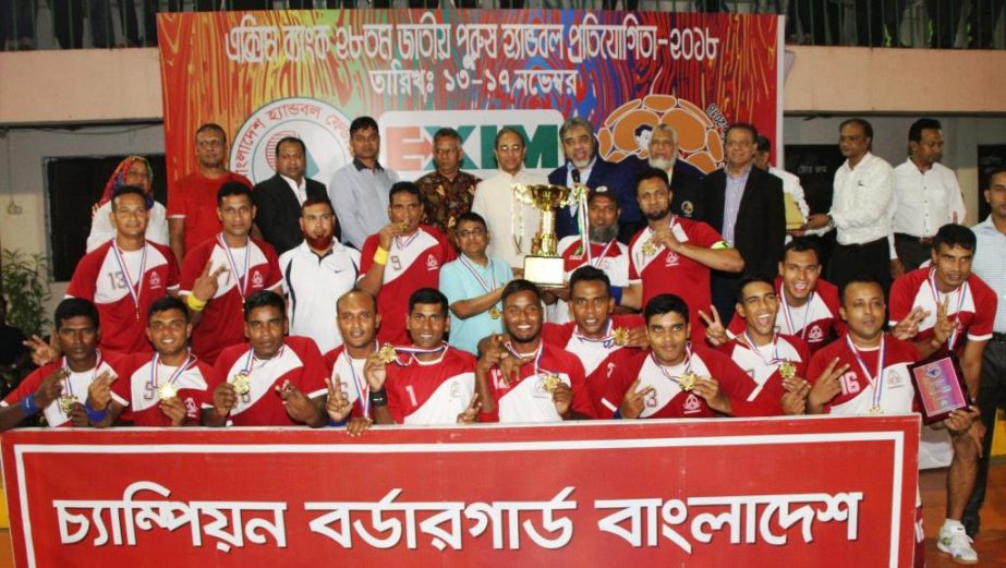 Members of BGB, the champions of the EXIM Bank 28th National Handball Competition with the guests and officials of Bangladesh Handball Federation pose for a photo session at the Shaheed (Captain) M Mansur Ali National Handball Stadium on Saturday. BGB def