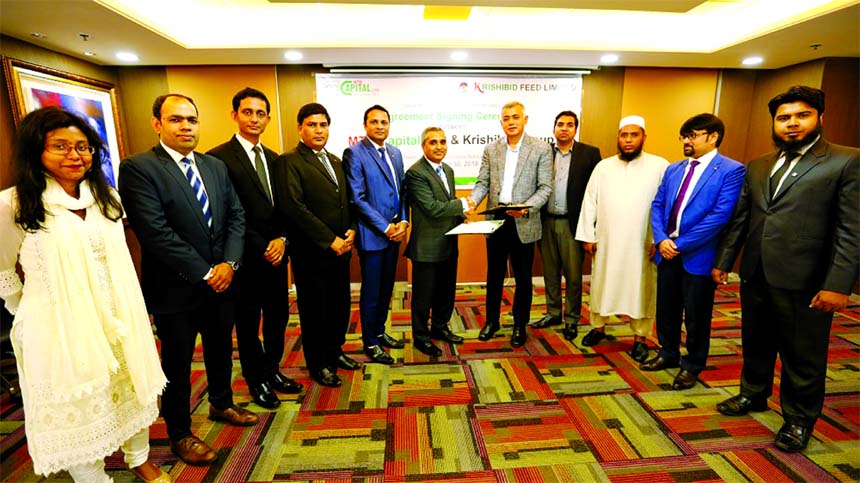 Khairul Bashar Abu Taher Mohammed, CEO of MTB Capital Limited (MTBCL) and Dr. Ali Afzal, Chairman of Krishibid Feed Limited, exchanging an agreement signing document at the Bank's head office in the city recently. Under the deal, MTBCL will act as the Is