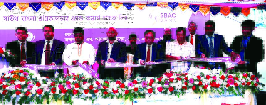 Mohammad Nawaz, Director of South Bangla Agriculture & Commerce (SBAC) Bank Ltd, inaugurating its 66th branch at Abdullahpur in South Keranigonj of Dhaka on Sunday. Md. Golam Faruque, Managing Director of the bank presided over the ceremony. DMD Tariqul