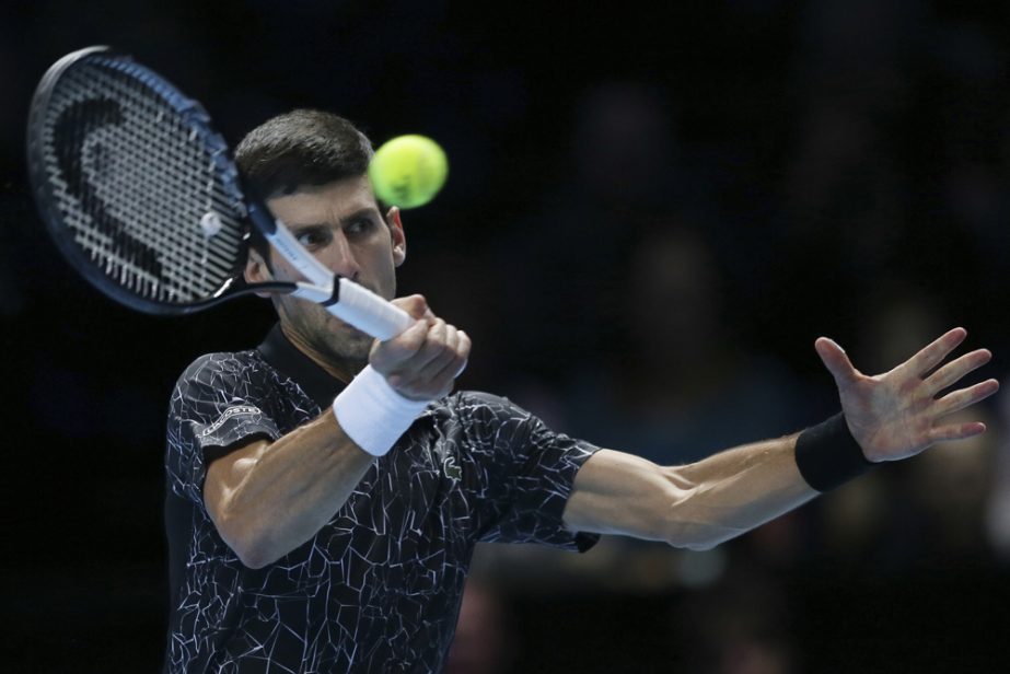 Novak Djokovic of Serbia plays a return to Kevin Anderson of South Africa in their ATP World Tour Finals singles tennis match at the O2 Arena in London on Saturday.