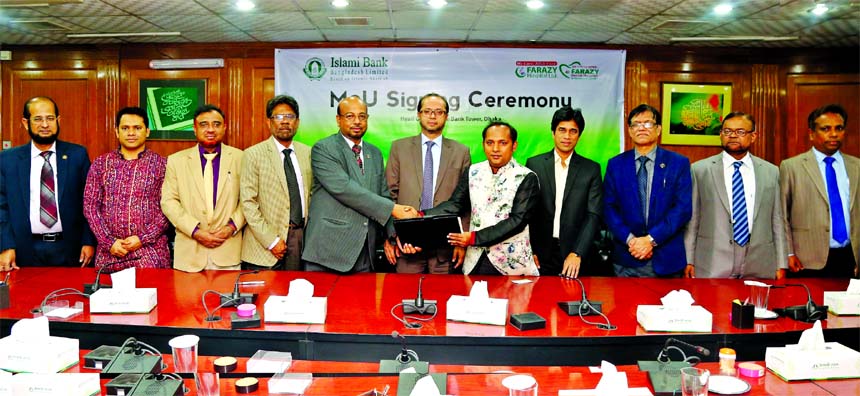 Abu Reza Md. Yeahia, DMD of Islami Bank Bangladesh Limited and Dr. Anower Farazy Emon, Chairman of Farazi Hospital Limited, exchanging an agreement signing documents at the Bank's head office in the city on Monday. Under the deal, VISA and Khidmah Card h