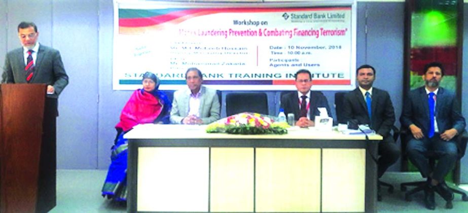 Md. Motaleb Hossain, DMD of Standard Bank Limited, addressing at a day-long workshop on "Money Laundering Prevention & Combating Financing Terrorism" for its Agents Bankers at the Bank's Training Institute in the city recently. Md. Zakaria, Principal a