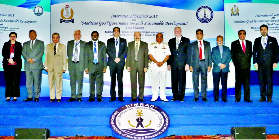 Prime Minister's Security Affairs Adviser Major General (Retd) Tarique Ahmed Siddique and Chief of Naval Staff Admiral Nizamuddin Ahmed pose for a photo session with the participants of a seminar on â€˜Maritime Good Governance towards Sustainable Dev