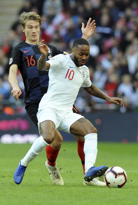 Croatia's Tin Jedvaj (left) vies for the ball with England's Raheem Sterling during the UEFA Nations League soccer match between England and Croatia at Wembley stadium in London on Sunday.